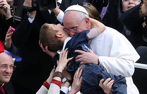 Pope_Francis_embraces_a_boy_prior_to_his_first_Urbi_et_Orbi_blessing_on_Easter_Sunday_March_31_2013_Credit_Franco_Origlia_Getty_Images_News_Getty_Images_CNA_4_3_13